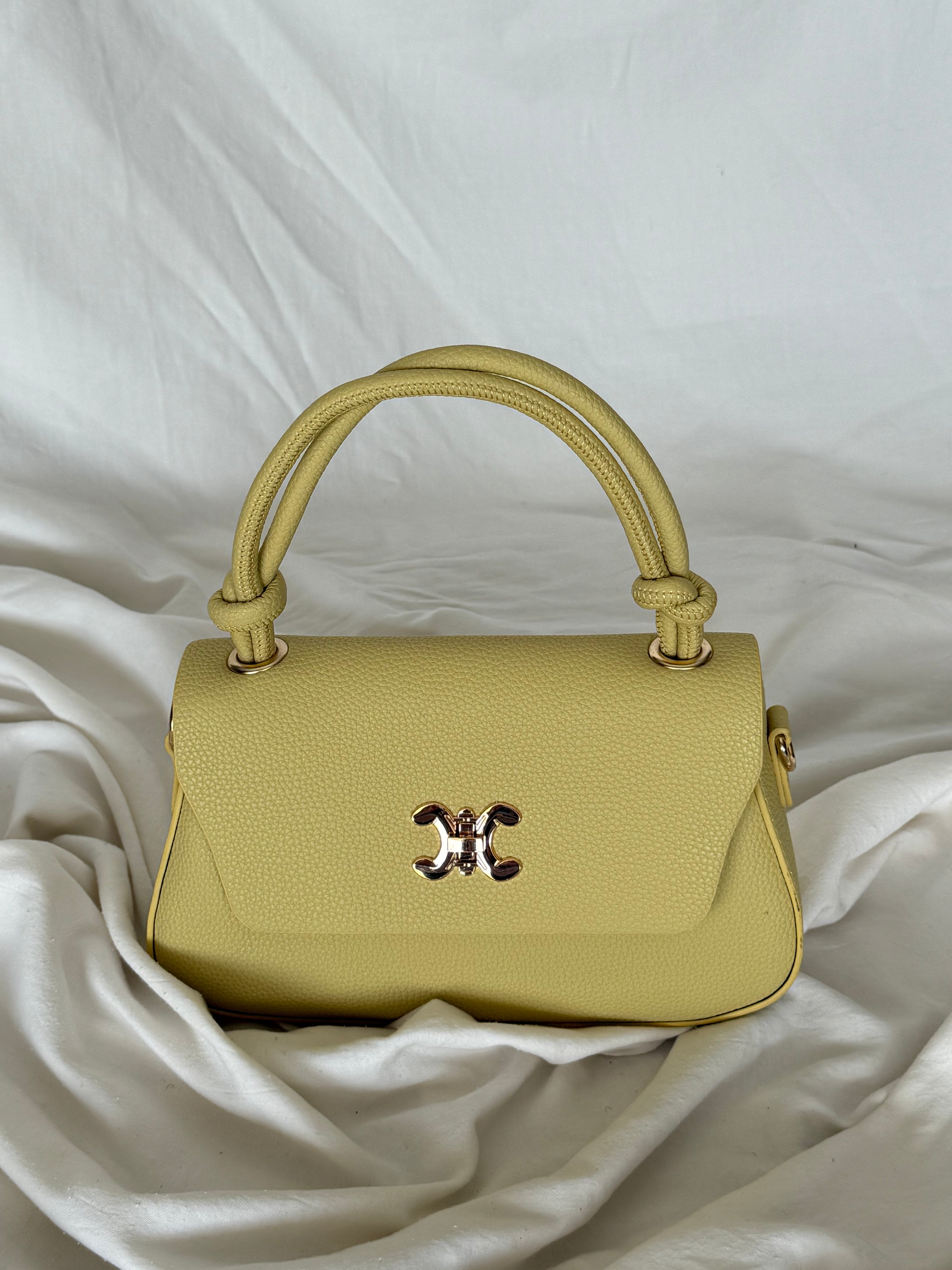 Κομψό κίτρινο παλ τσαντάκι χειρός με επιπλέον λουρί για να φοριέται και χιαστί