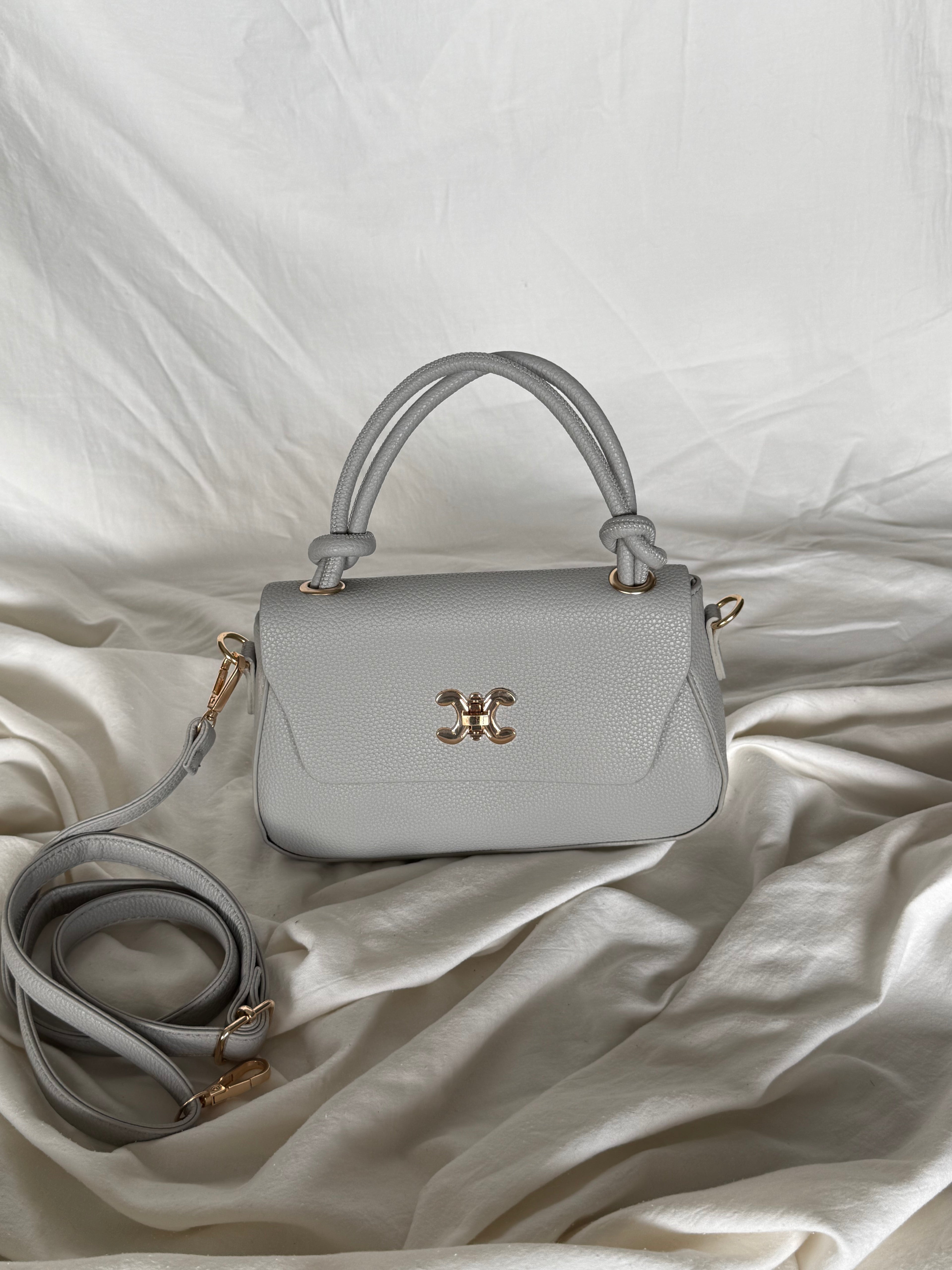 Κομψό γκρί τσαντάκι χειρός με επιπλέον λουρί για να φοριέται και χιαστί